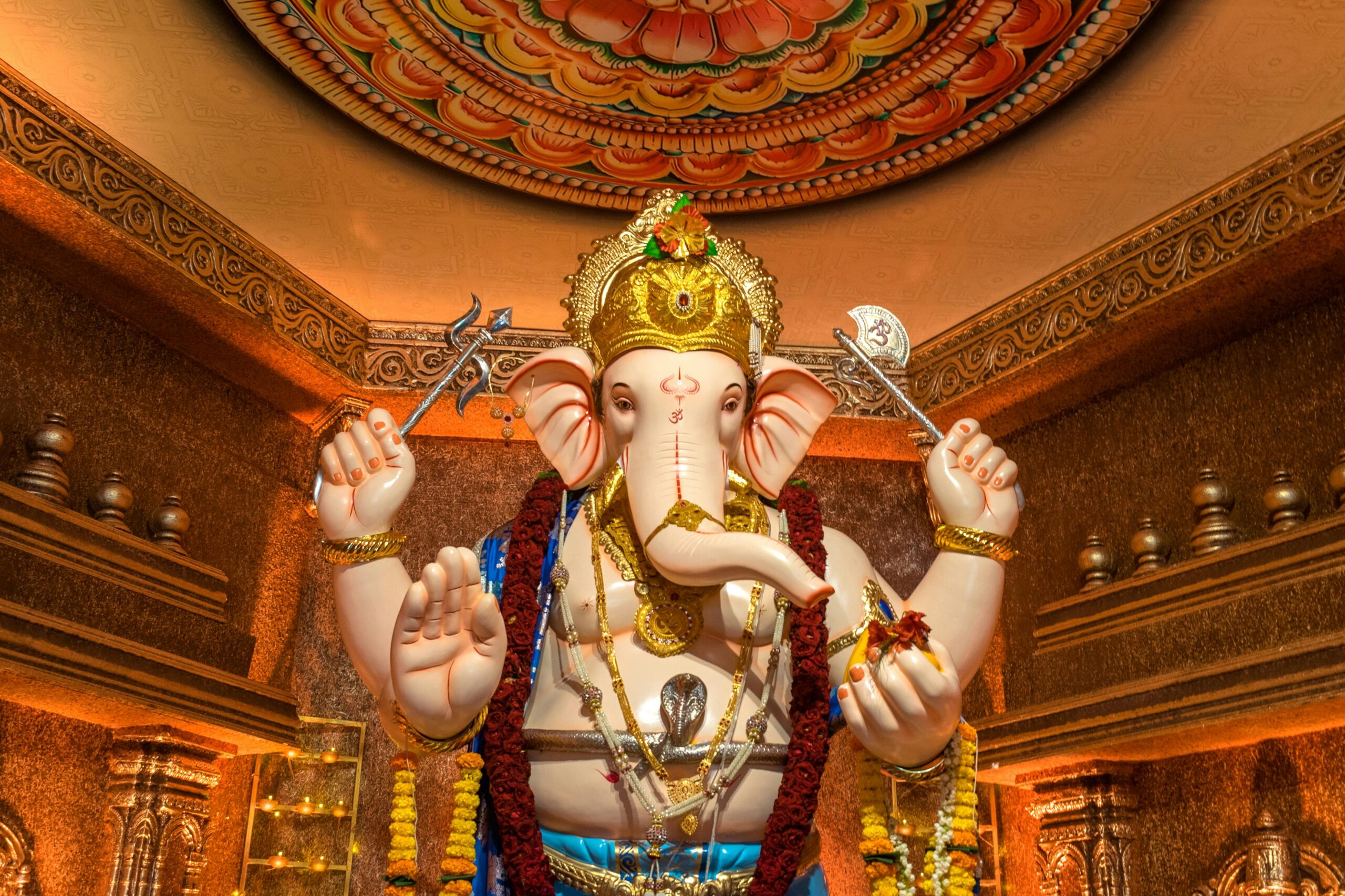 Decorative Ganesh idol in a Mumbai temple during Ganesh Chaturthi, showcasing vibrant cultural artistry.